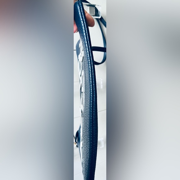 A navy blue shoulder and wristlet, adjustable strap to also wear as a crossbody - Picture 9 of 12